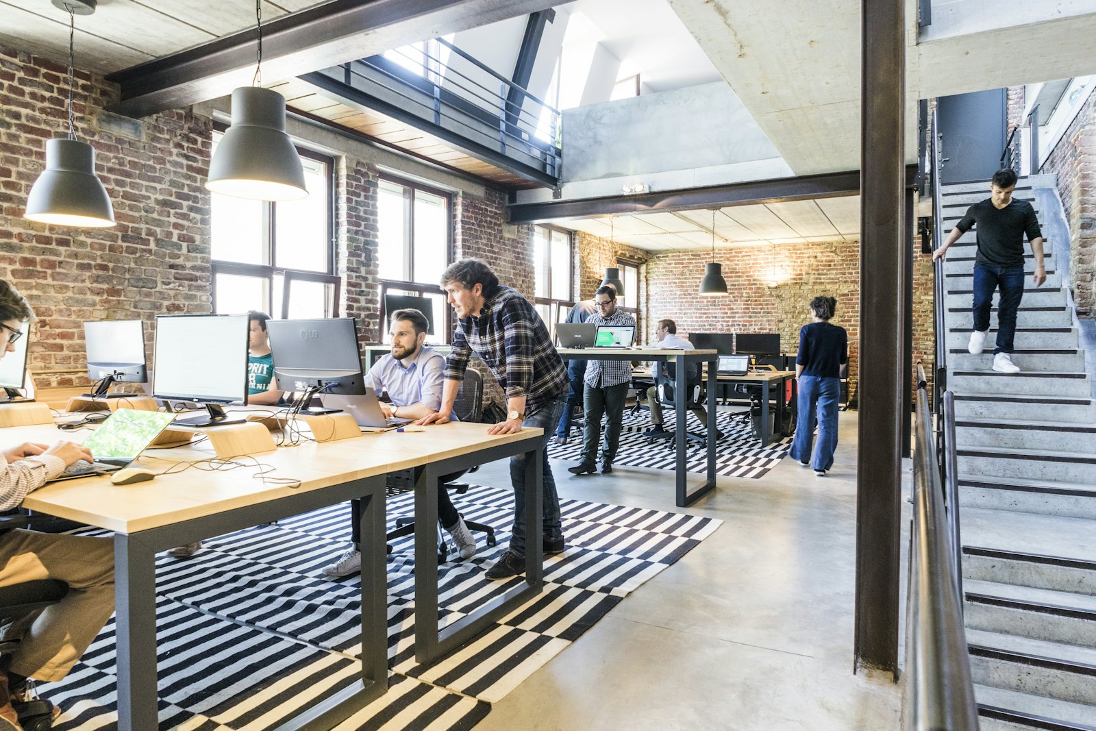 Two colleagues working through a deal together at a shared screen